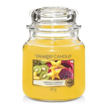 Yankee-Candle-Glas Tropical Starfruit mit gelbem Wachs und Fruchtmotiv