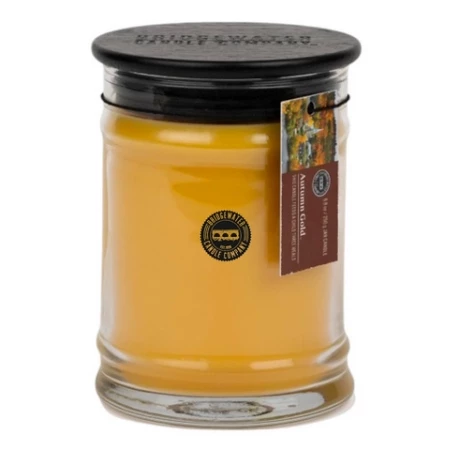 Autumn Gold Duftkerze im Glas Gelbe Duftkerze im Glas mit schwarzem Deckel und Anhängeetikett