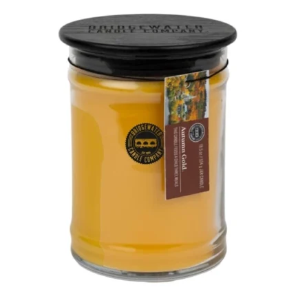Gelbes Bridgewater-Kerzenglas mit schwarzem Deckel und Autumn-Gold-Etikett