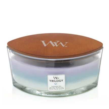 Glasbehälter mit braunem WoodWick-Deckel und Trilogy-Etikett
