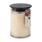Creamfarbene Kerze im Glas mit schwarzem Deckel und rotem Vogel auf dem Etikett
