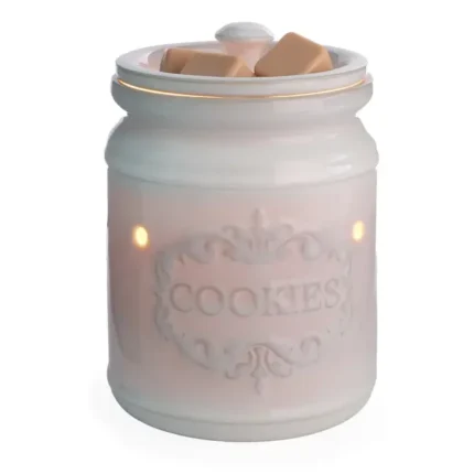Weiße Cookie Jar Duftlampe mit sichtbaren Wachsstücken und leuchtenden Öffnungen