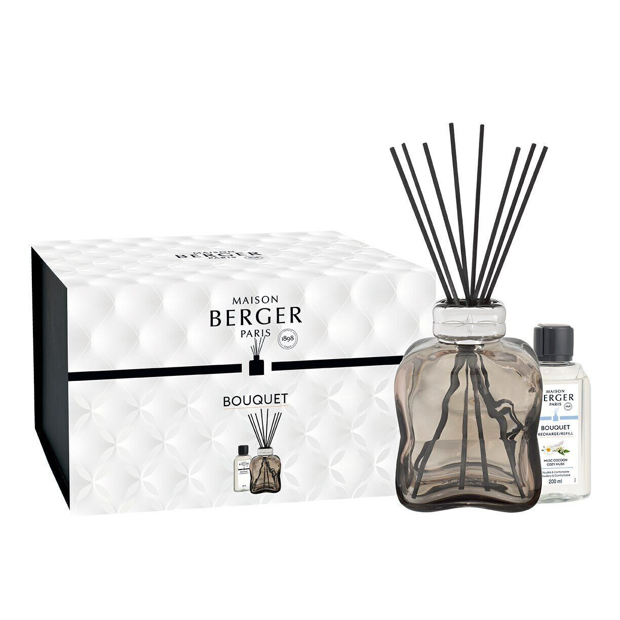 Bouquet Diffuser mit Nachfüllflasche Maison Berger Bouquet Diffuser neben beschrifteter Nachfüllflasche und Verpackung