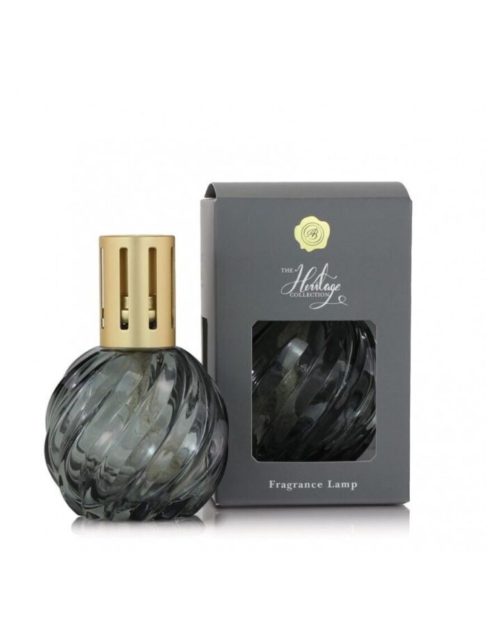 Graue Heritage Duftlampe neben Verpackung mit sichtbarem Produkt und Aufdruck