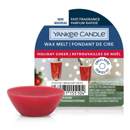Roter Wax Melt vor Yankee Candle Holiday Cheer Verpackung