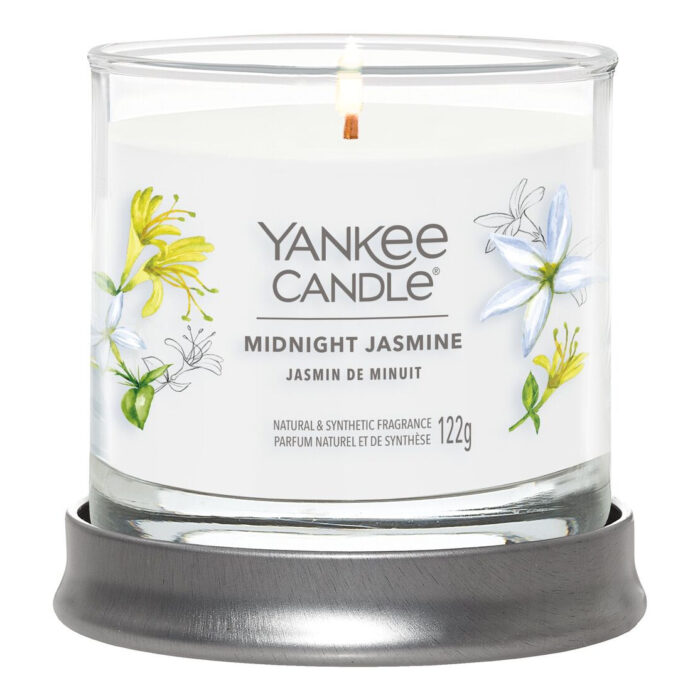 Brennende Midnight Jasmine Kerze im Glas mit grauem Untersetzer