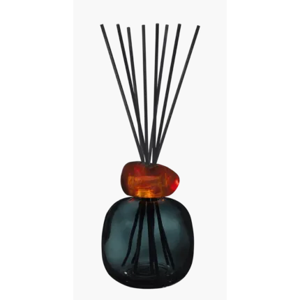 Raumduft-Diffuser mit schwarzem Gefäß, amberfarbenem Aufsatz und Duftstäbchen