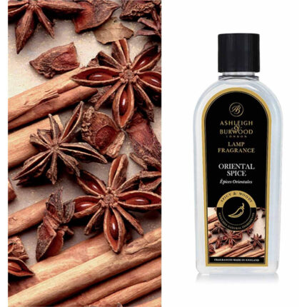Flasche mit Oriental Spice Lamp Fragrance neben Sternanis und Zimtstangen
