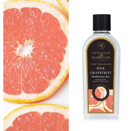 Flasche mit Pink Grapefruit Lamp Fragrance neben aufgeschnittenen Grapefruits