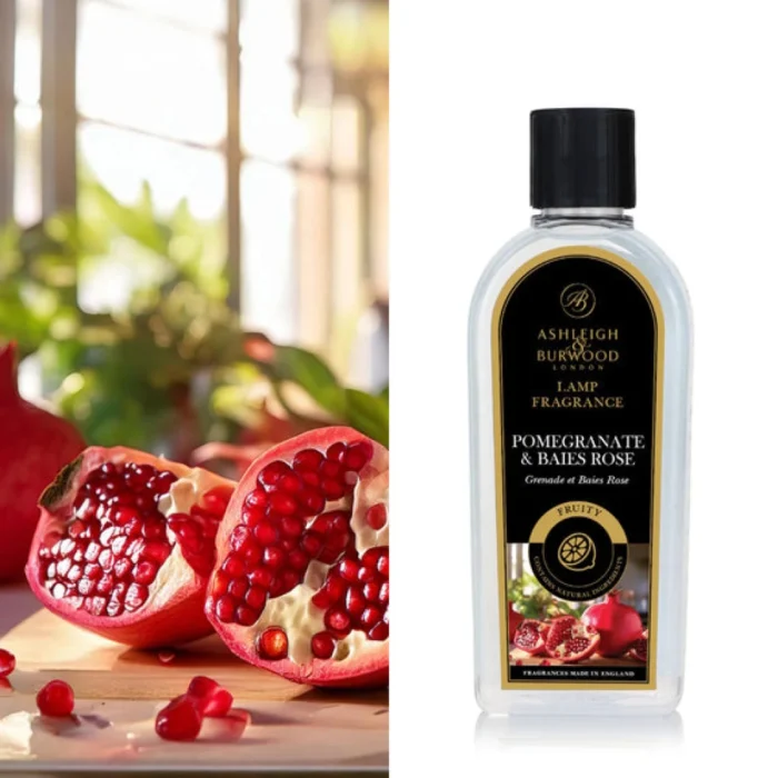 Ashleigh-&-Burwood-Flasche mit Duftlampenöl neben Granatapfelhälften