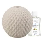 Weißer Aroma-Diffuser neben Nachfüllflakon mit lesbarem 475-ml-Etikett