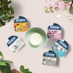 Coconut Splash Wachsmelt neben einer Duftlampe auf einem Holztisch