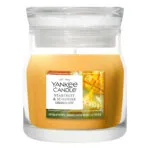Yankee Candle Starfruit & Sunshine Duftkerze im Glas vor weißem Hintergrund