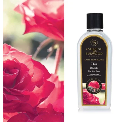Tea Rose Lamp Fragrance Flasche neben einer roten Rose