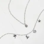 Silberfarbene Fußkette mit Stern-, Muschel-, Palme- und Flamingoanhängern