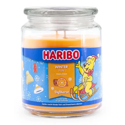 Haribo Winter Fun Duftkerze im Glas mit Deckel und orangefarbenem Wachs